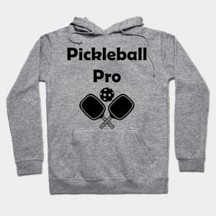 Pickleball pro with paddles in black Hoodie